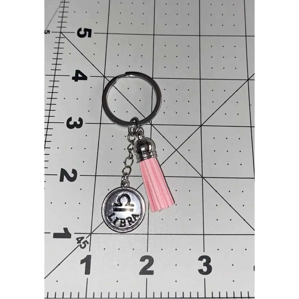 ☀️3/$9☀️ Gemini Keychain with Yellow Tassel